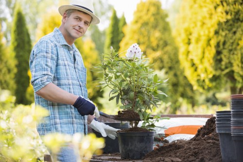 Commercial outdoor landscaping improvement in Bow with tidy borders and durable surfaces
